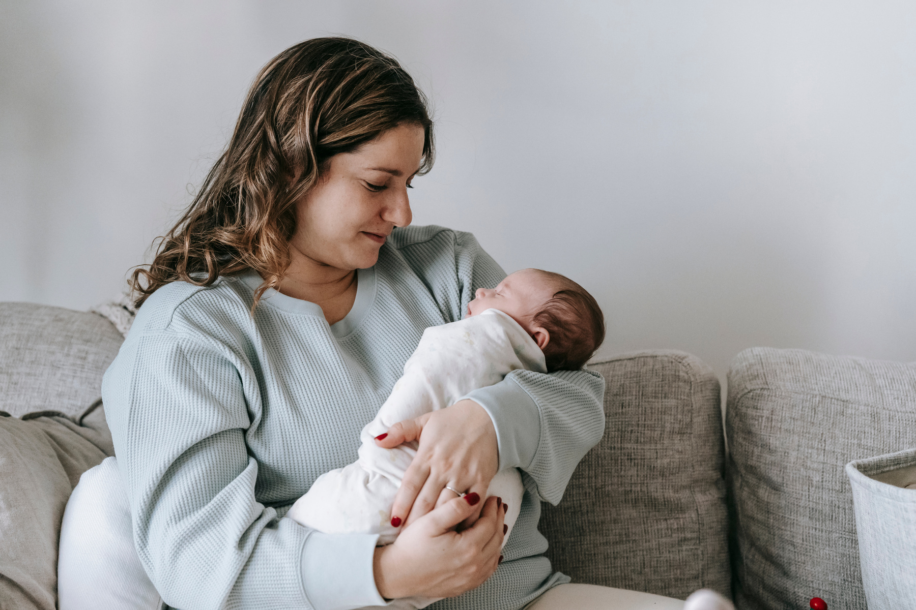 Mother with newborn baby in arms